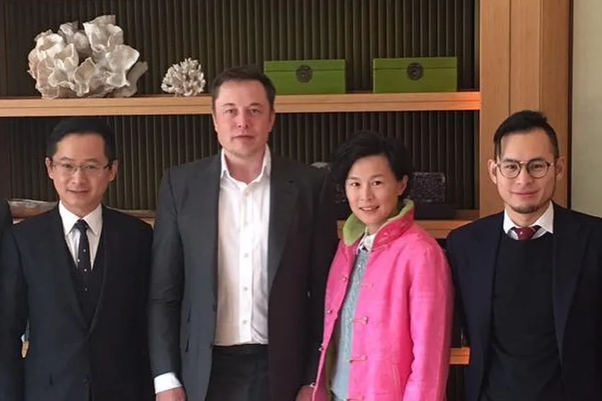 Dr Gi Chao with Elon Musk and colleagues